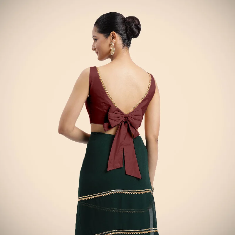 Sherry x Tyohaar | Burgundy Sleeveless FlexiFit™ Saree Blouse with Simple Golden Gota Lace on Neckline and Removable Bow on Back