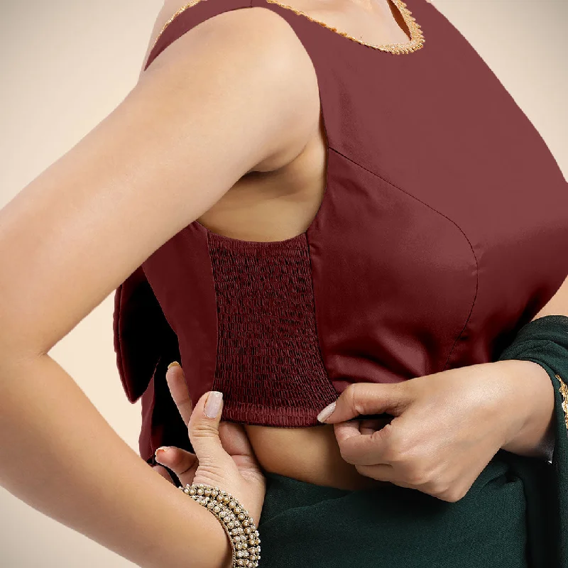 Sherry x Tyohaar | Burgundy Sleeveless FlexiFit™ Saree Blouse with Simple Golden Gota Lace on Neckline and Removable Bow on Back